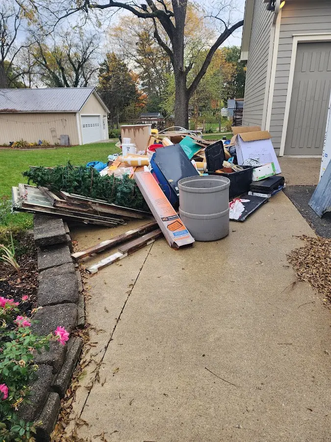 Dumpster being loaded with debris for Commercial Dumpster Rental in Goodland